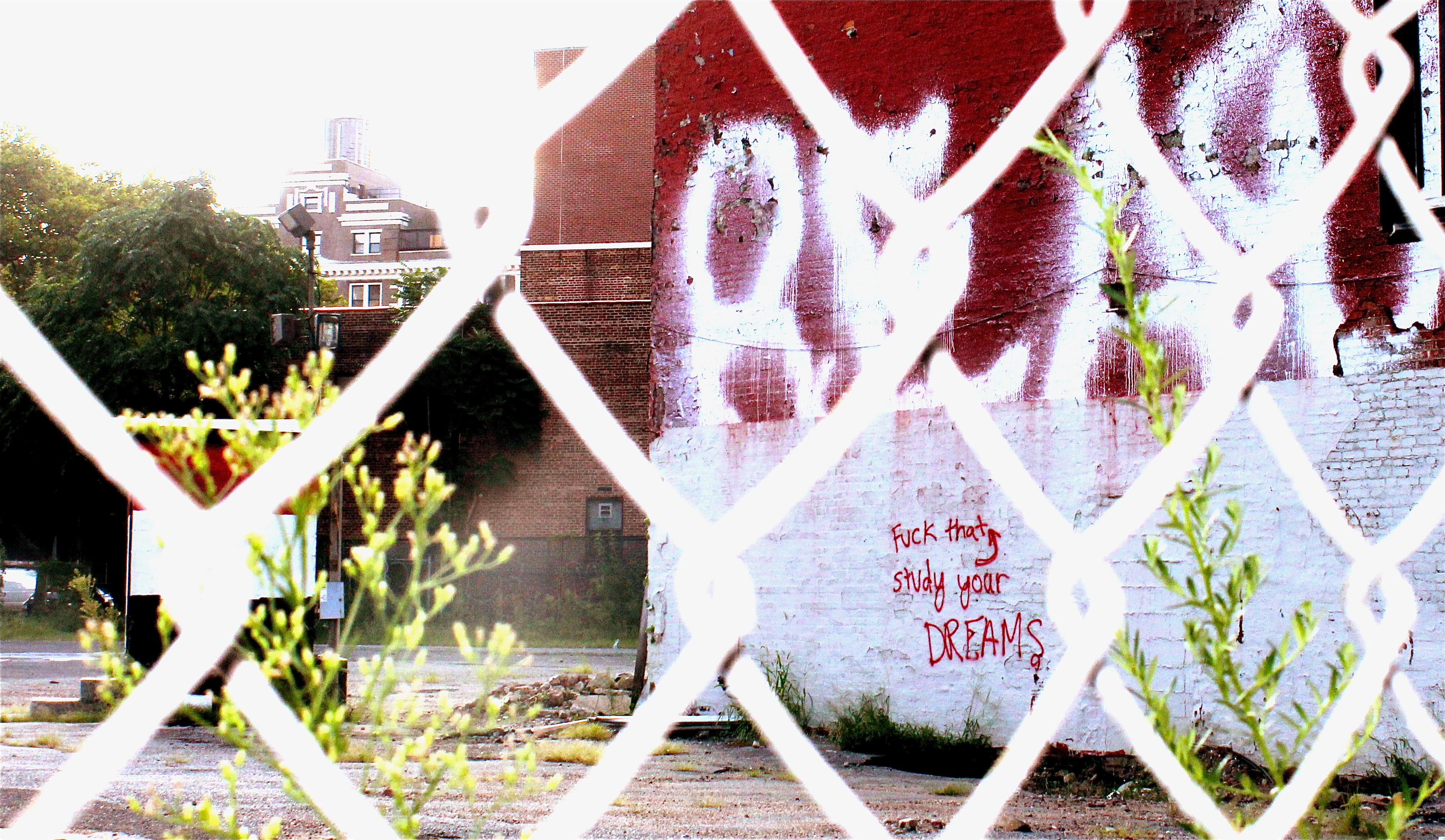 Graffiti and street markings on a Brooklyn building facade